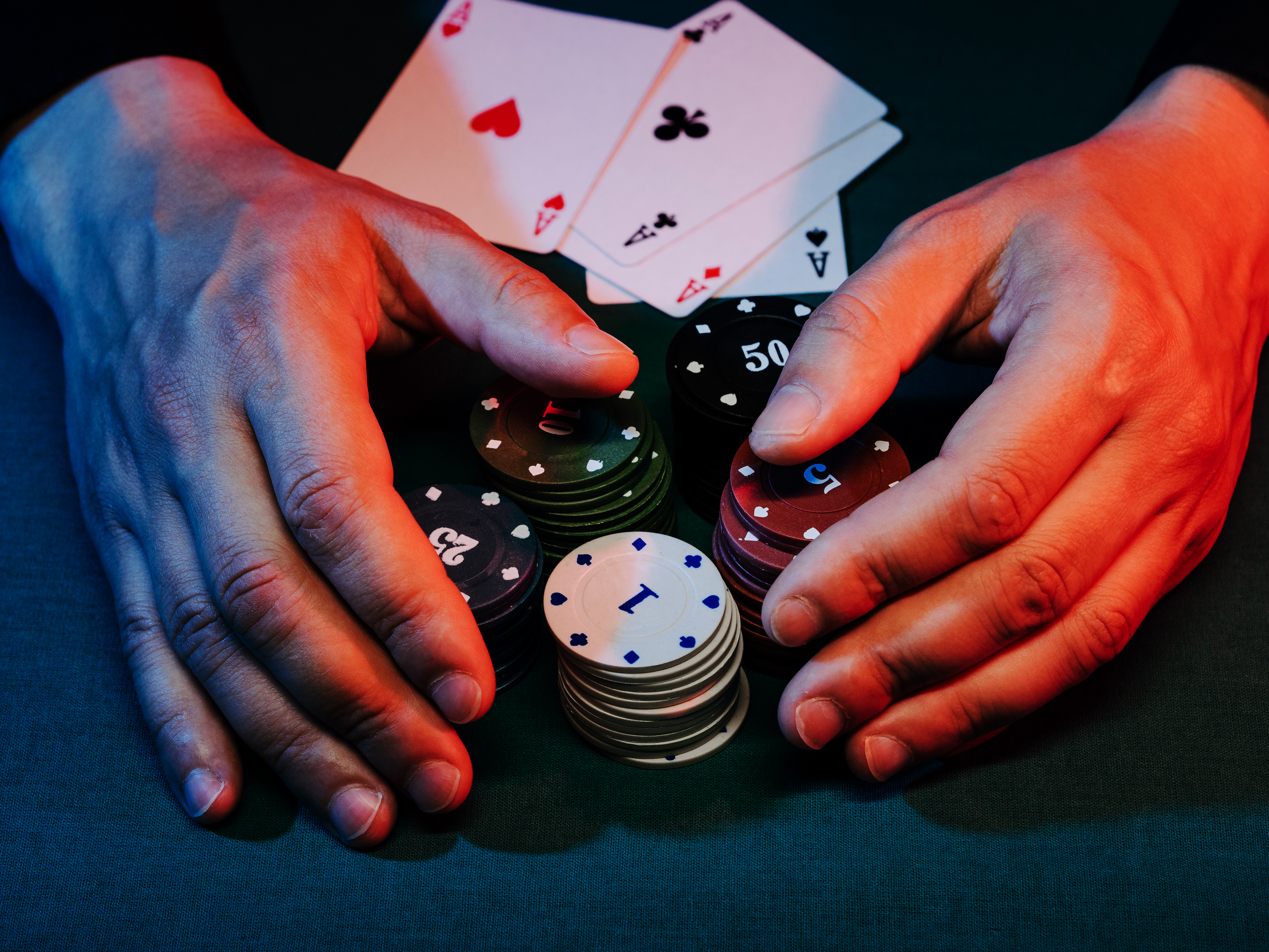 men's hands take away the playing chips placed on the bet. victory